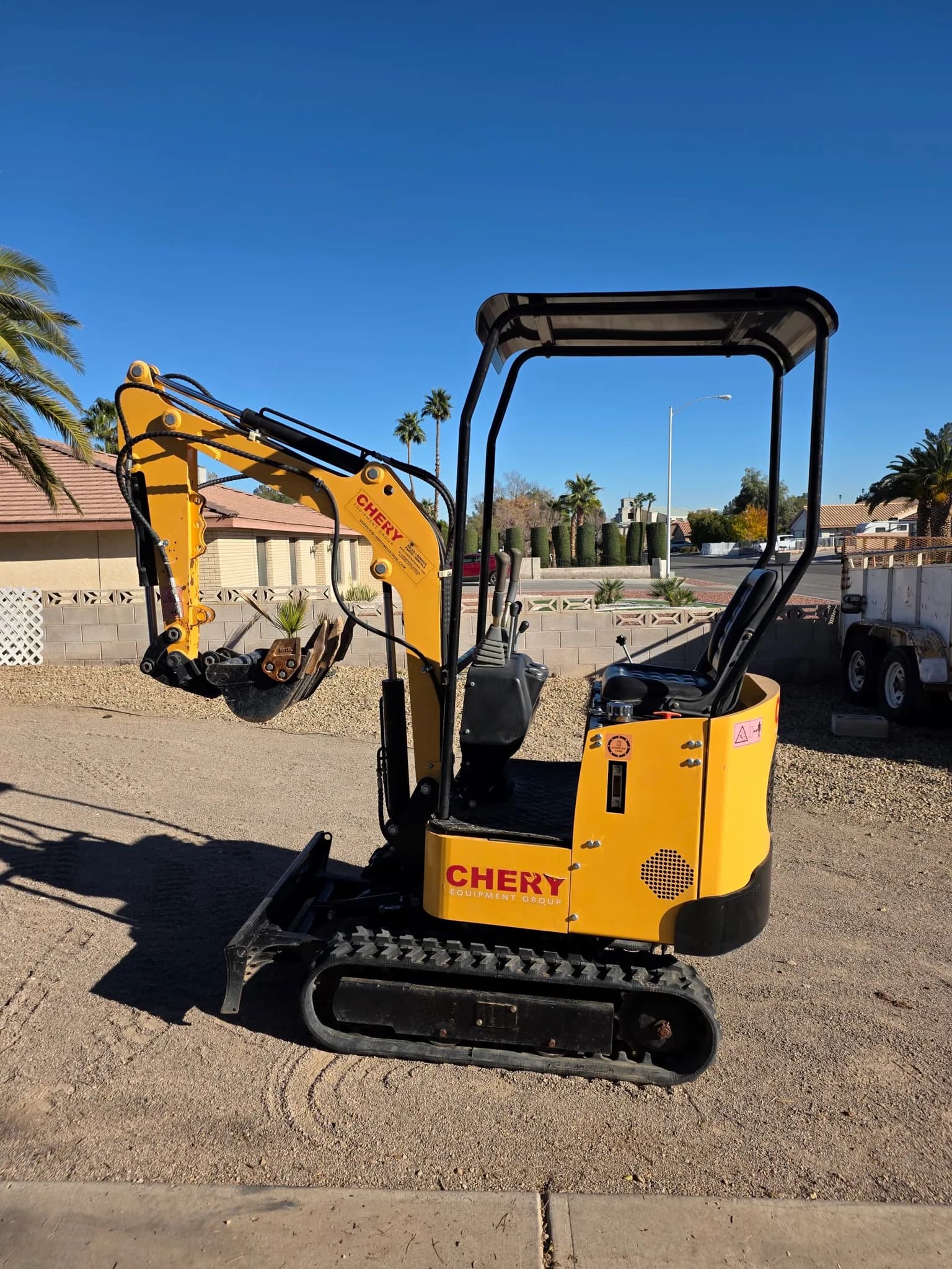 Mini Excavator with Attachments — photo 3 of 5